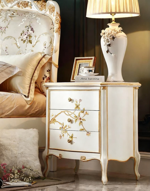 GrandLiving Luxe French Provincial solid wood bedside table featuring hand-carved detailing, hand-painted floral art, and gold leaf accents.1